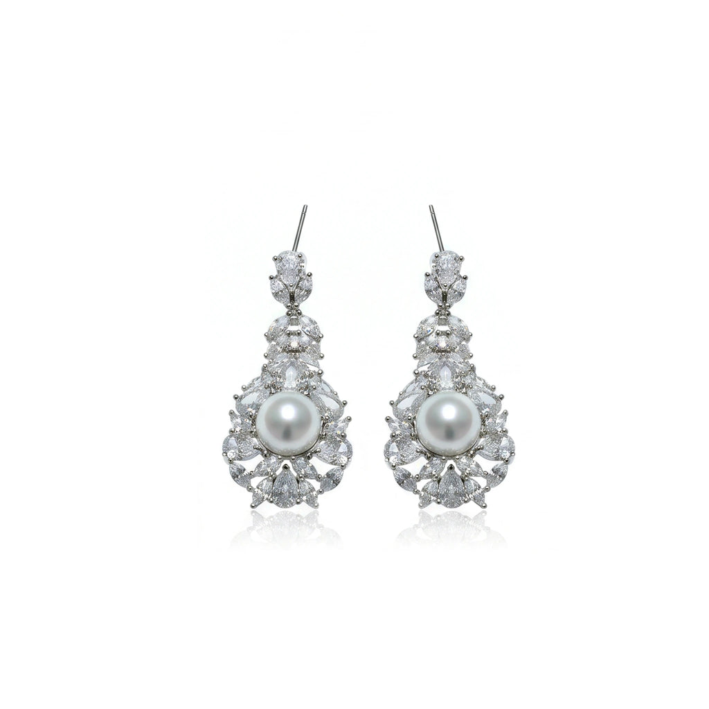 طقم فاخر كلاسيكي من احجار الزركون و اللؤلؤ Luxurious, classic Big-set featuring zircon stones and pearls.