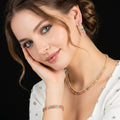 طقم مجوهرات عصري من احجار الزركون والاحجار الملونة الكيوبك Modern jewelry set featuring zircon and colored cubic stones.